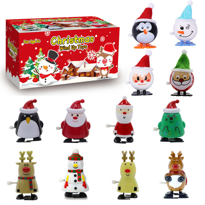 "Färgglad snurrande julleksak i plast med motiv av tomte och snögubbe, perfekt för barnens festliga dekorationer."