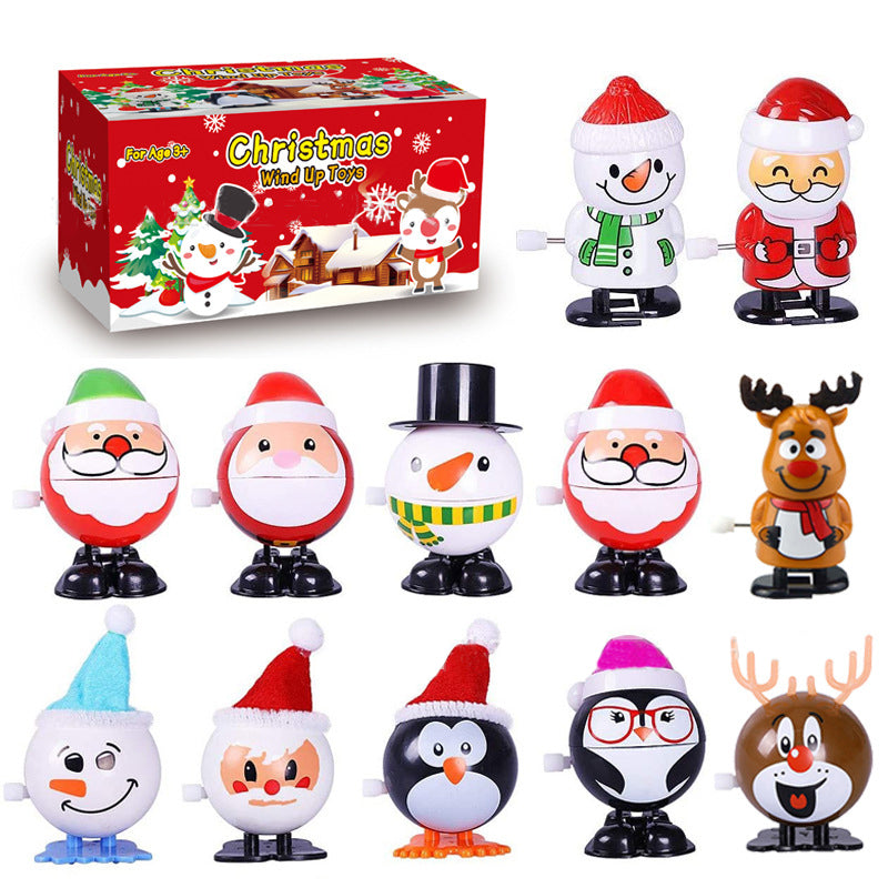 "Färgglad snurrande julleksak i plast med motiv av tomte och snögubbe, perfekt för barnens festliga dekorationer."