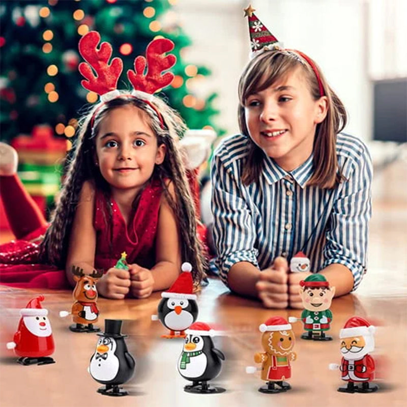 "Färgglad snurrande julleksak i plast med motiv av tomte och snögubbe, perfekt för barnens festliga dekorationer."