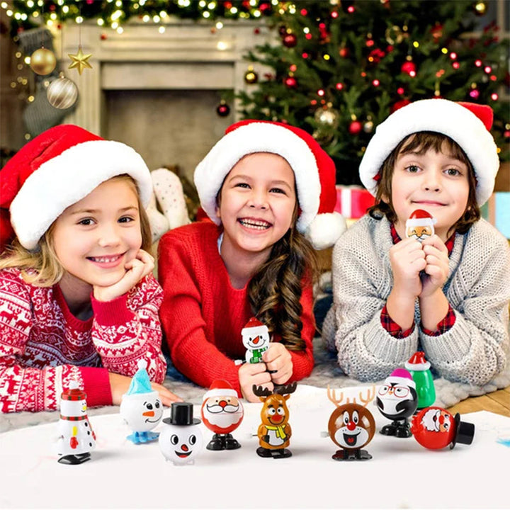 "Färgglad snurrande julleksak i plast med motiv av tomte och snögubbe, perfekt för barnens festliga dekorationer."