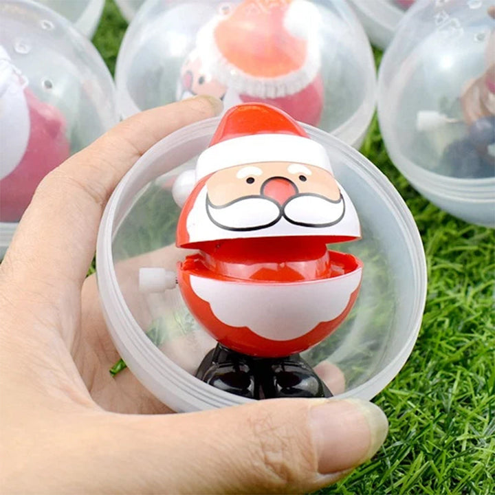 "Färgglad snurrande julleksak i plast med motiv av tomte och snögubbe, perfekt för barnens festliga dekorationer."