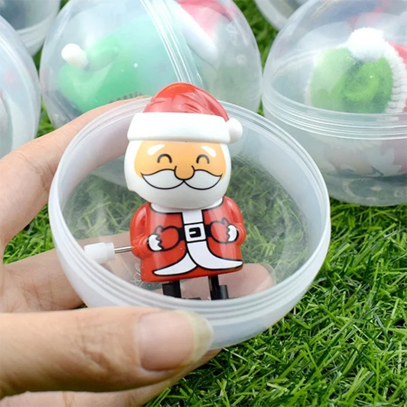 "Färgglad snurrande julleksak i plast med motiv av tomte och snögubbe, perfekt för barnens festliga dekorationer."