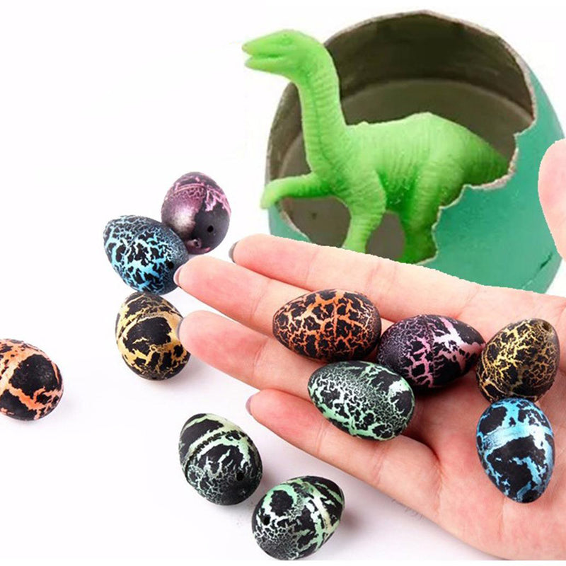 Färgglada dinosaurieägg för barn, spricker i vatten till figurer, pedagogisk leksak inom påsklekar och lärande.