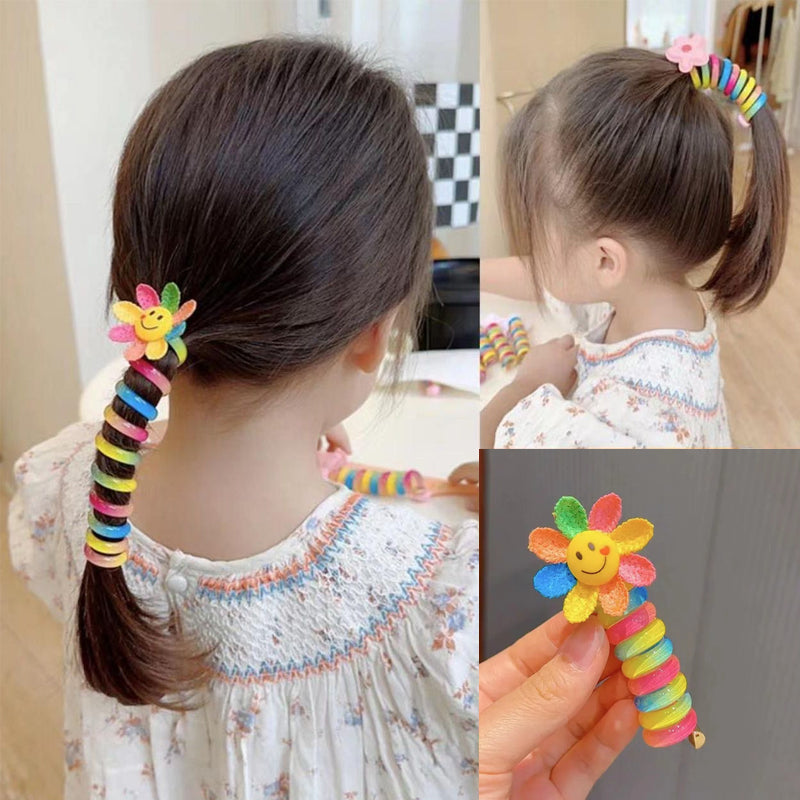 "Färgglada, elastiska hårband för barn med tecknade motiv och blommönster i flera färger, perfekta för daglig användning."