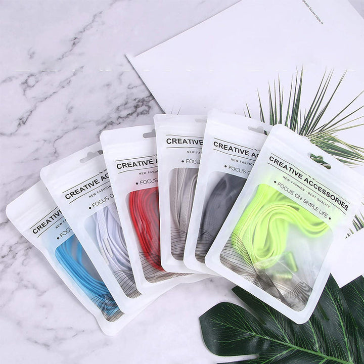 "Färgglada justerbara knytfria skosnören för damer, i elastiskt material med robust lås, visar randiga och enfärgade alternat