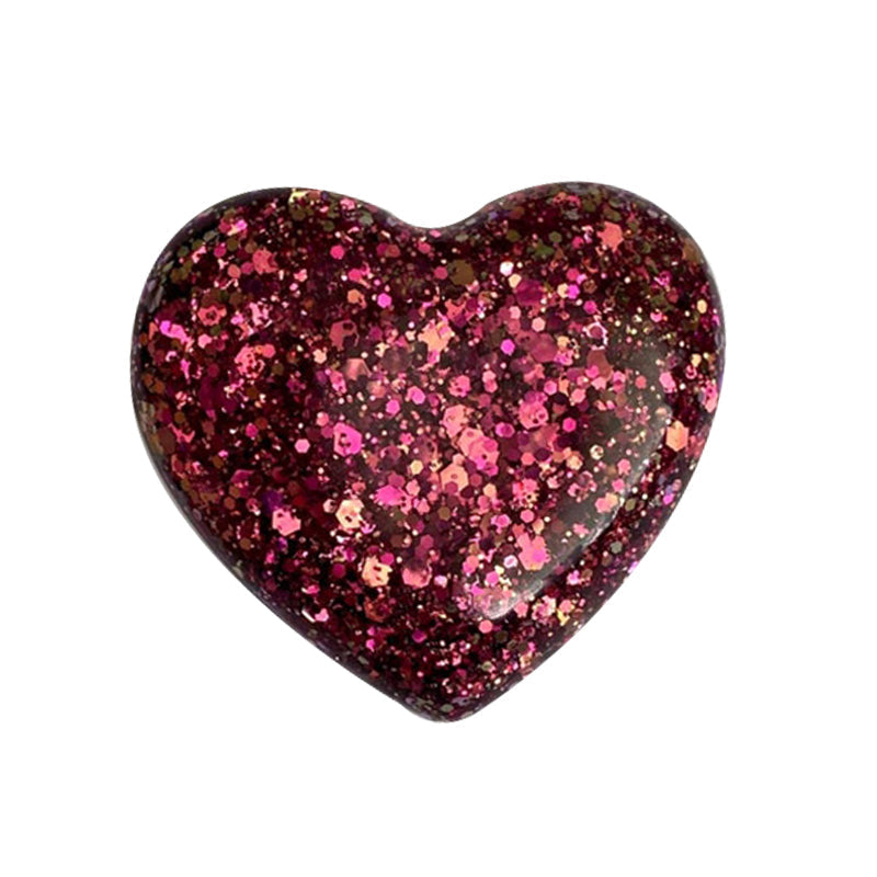 "Färgglatt hjärta i harts, fickvänlig accessoar med kärleksfullt budskap i olika nyanser: guld, blå, lila, grön."