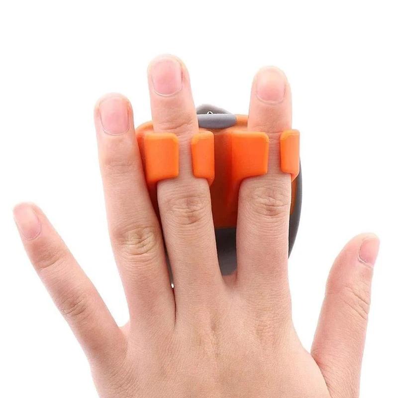 "Fingerskalare i grön och orange, ergonomisk design, kökspryl för säker och enkel hantering av frukt och grönsaker."