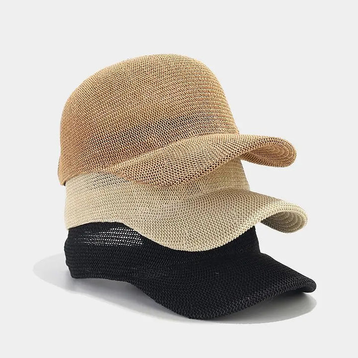 Flätad solhatt för dam med bred skärm, perfekt för UV-skydd på stranden. Stilren sommarhatt.