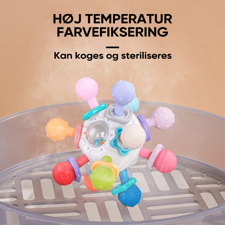 Flerfärgade babyleksaker med tandvänlig design, atomform och texturerade tuggpunkter för sensorisk stimulans.