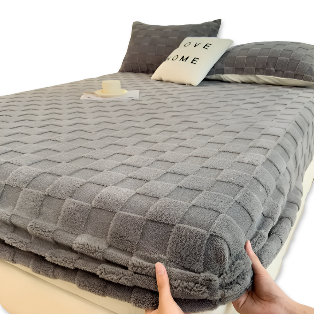 Fluffigt spännlakan i polyester för vintern, mjukt sängkläder som ger värme och komfort.