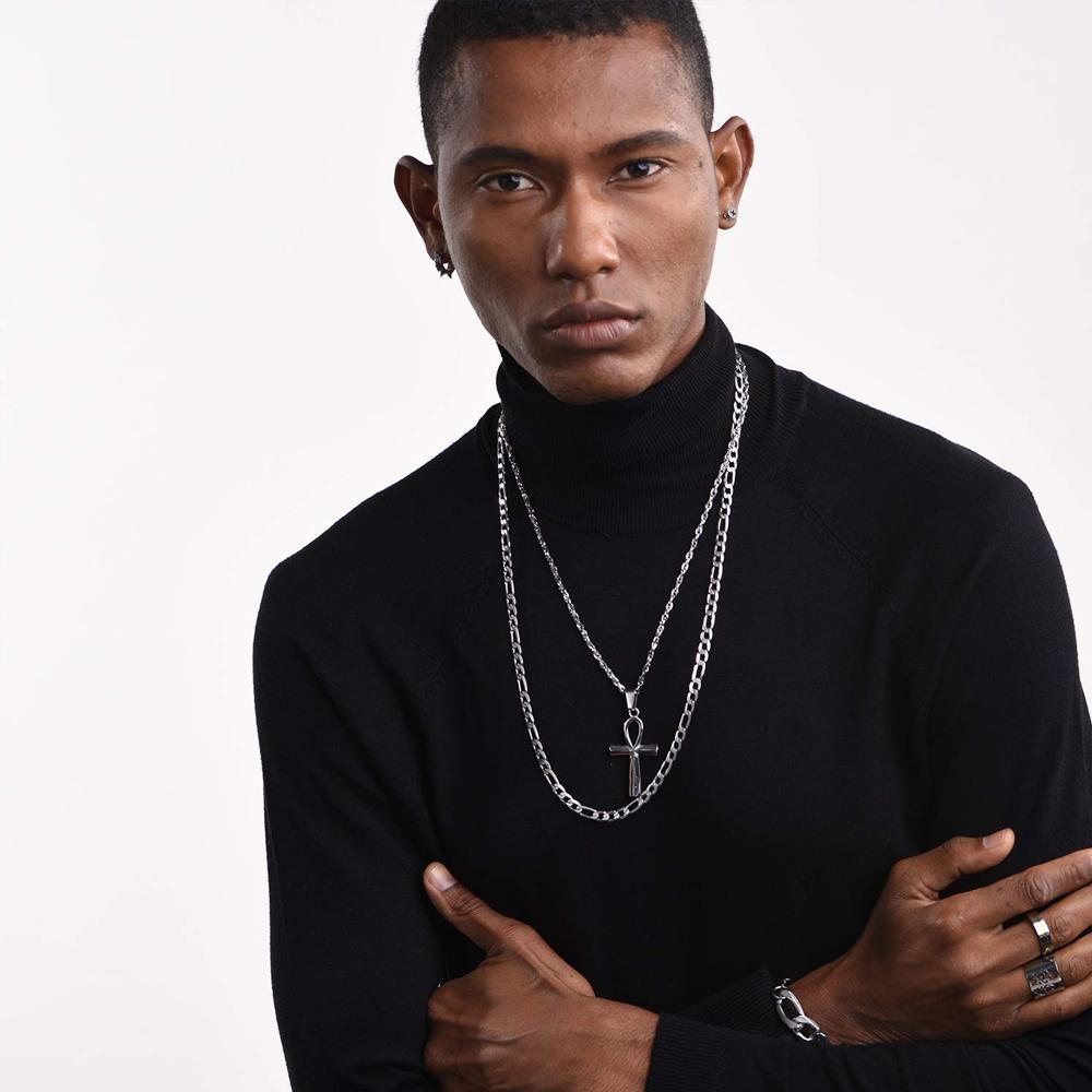 "Forntida egyptiskt kors halsband i rostfritt stål, silverfärgat, med detaljerad korsdesign och justerbar kedja."