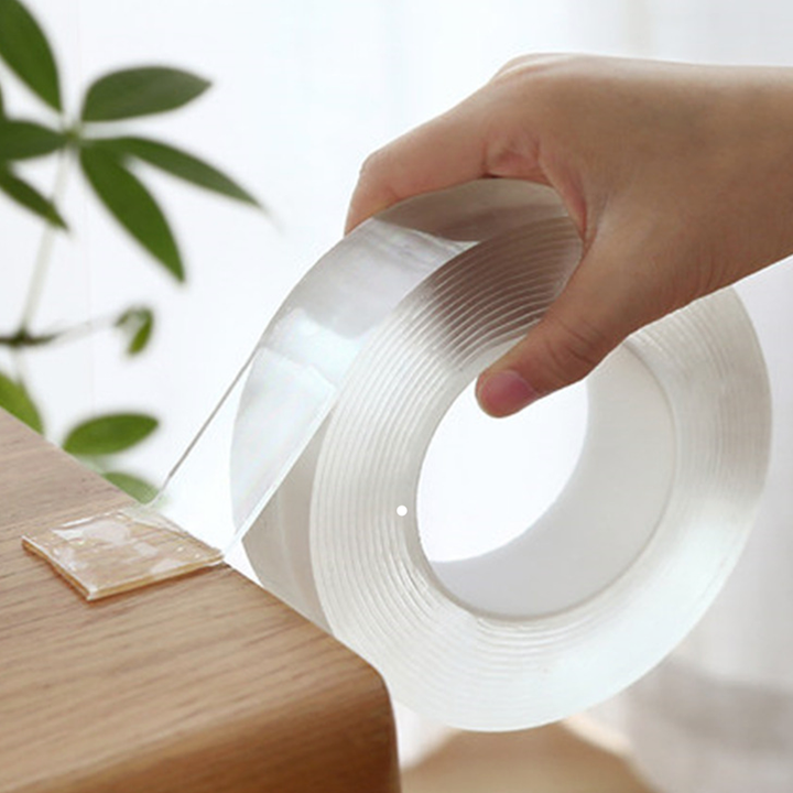 "Genomskinlig, självhäftande nanotejp rullad på spole, stark och återanvändbar, perfekt för hemmet, lätt att fästa"