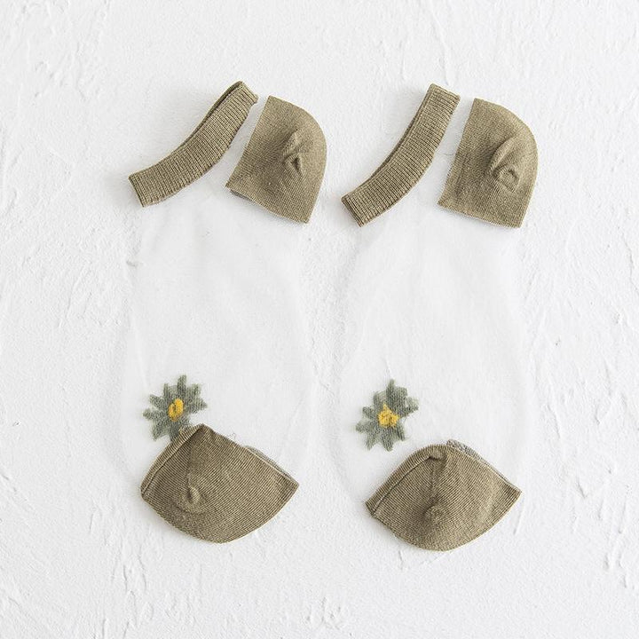 "Genomskinliga damsockor med blommotiv, feminin design med spets- och blomdetaljer, perfekt för sommaroutfits."