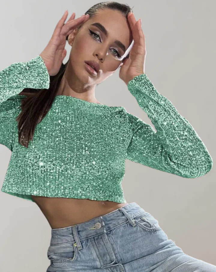 Stilren glittrig crop top, bekväm passform, idealisk som festtopp för en sofistikerad look.