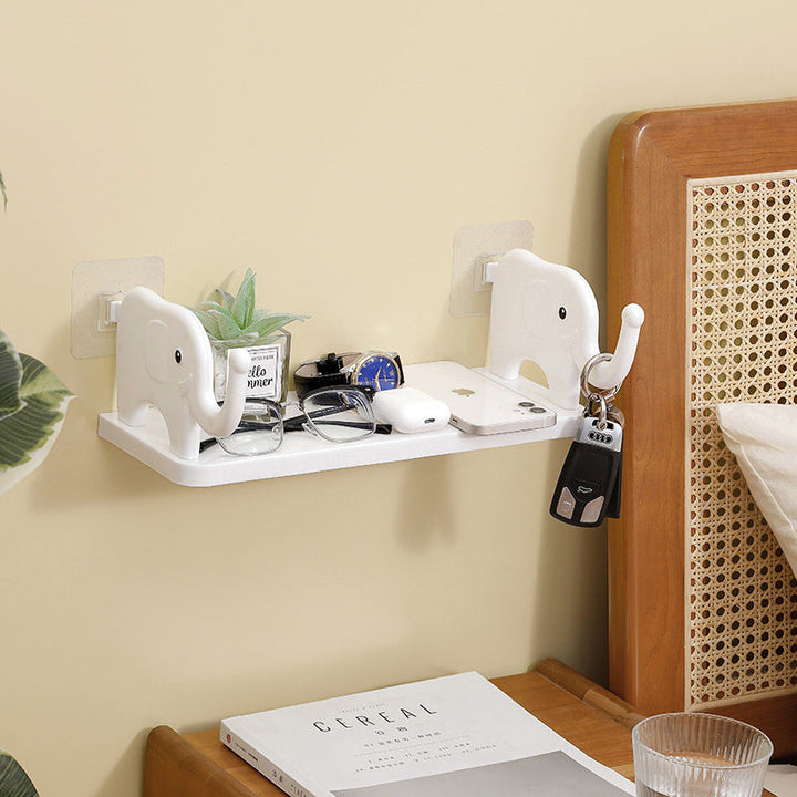 "Grå elefantformad hylla i plast, enkel och stilren, för väggförvaring och dekoration i hemmet, 32.5x20x11.5 cm."