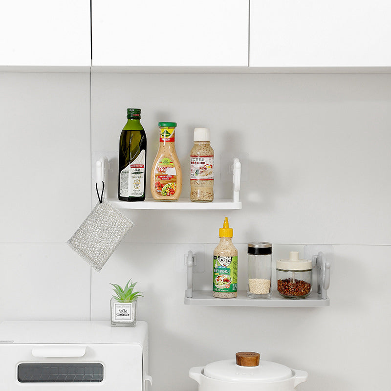 "Grå elefantformad hylla i plast, enkel och stilren, för väggförvaring och dekoration i hemmet, 32.5x20x11.5 cm."