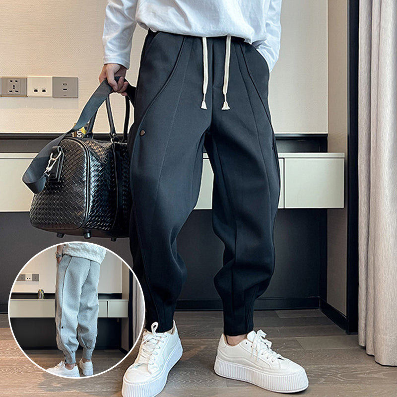 "Grå slim fit träningsbyxor för män i bomull/polyester, eleganta med elastisk midja för stil och komfort."