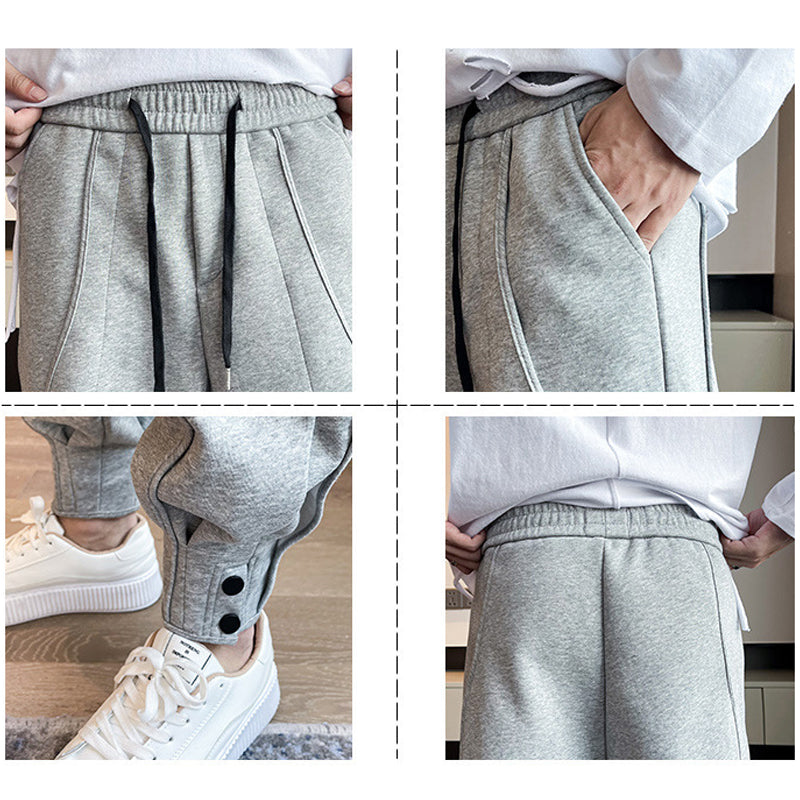 "Grå slim fit träningsbyxor för män i bomull/polyester, eleganta med elastisk midja för stil och komfort."