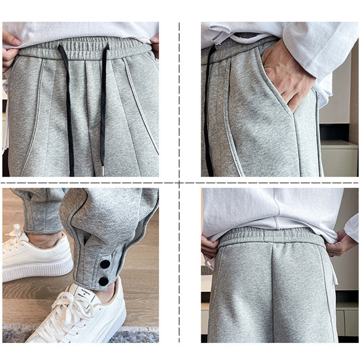 "Grå slim fit träningsbyxor för män i bomull/polyester, eleganta med elastisk midja för stil och komfort."
