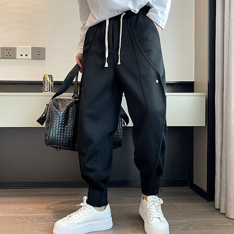 "Grå slim fit träningsbyxor för män i bomull/polyester, eleganta med elastisk midja för stil och komfort."