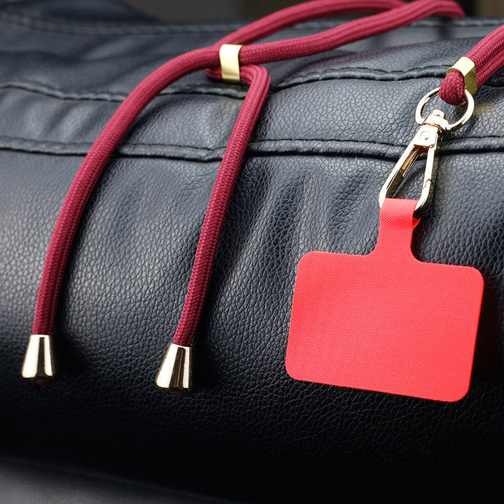 "Grön crossbody telefonband av nylon med metallspänne; justerbart för olika bärsätt, passar alla mobiler i damaccessoarer."