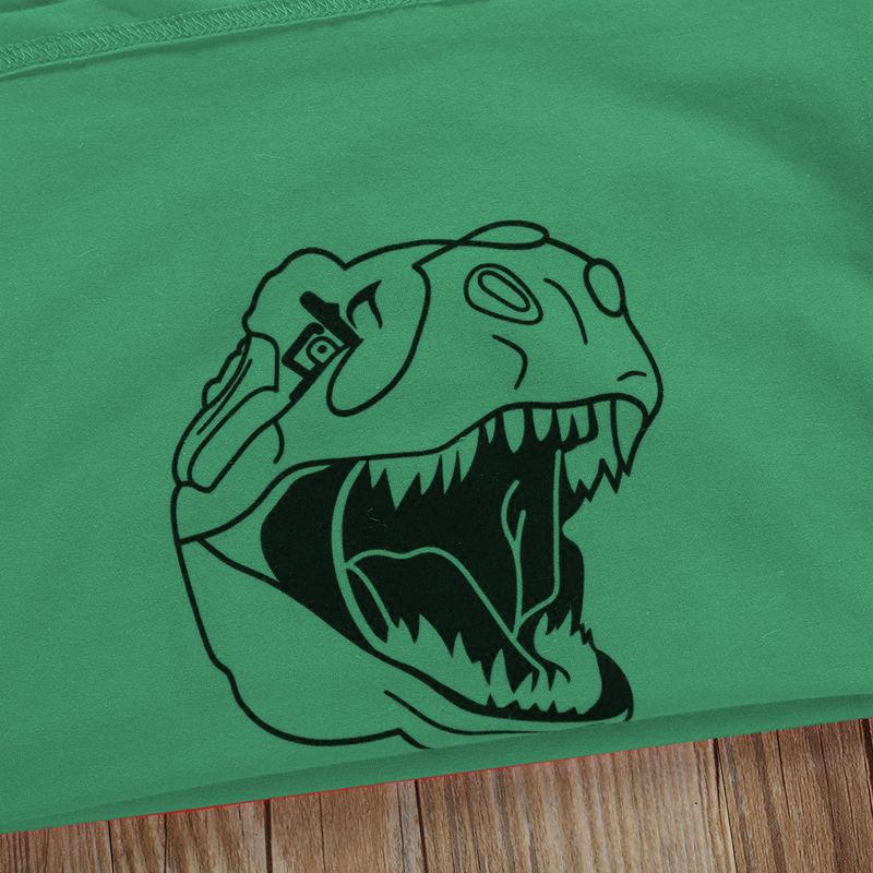 Grön dinosaurie-T-shirt för vuxna och barn med lekfullt T-rex-tryck, idealisk för alla dinosaurieälskare.