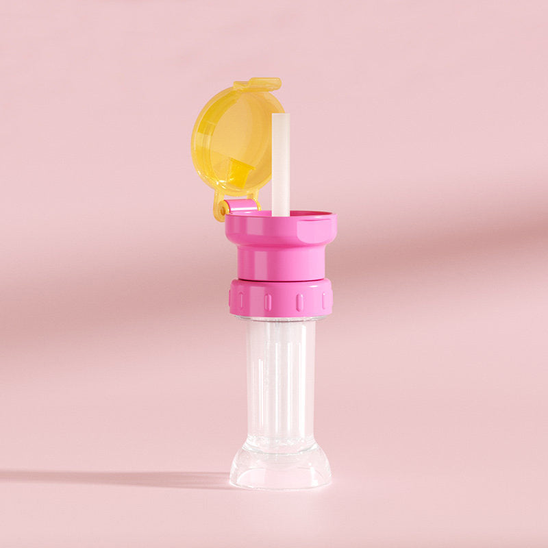"Grönt portabelt flasklock med sugrör, perfekt för barn och vuxna, enkel design, passar små och stora flaskor."