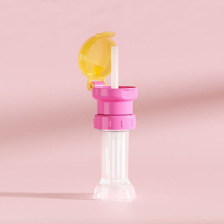 "Grönt portabelt flasklock med sugrör, perfekt för barn och vuxna, enkel design, passar små och stora flaskor."