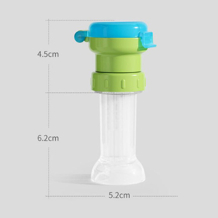 "Grönt portabelt flasklock med sugrör, perfekt för barn och vuxna, enkel design, passar små och stora flaskor."