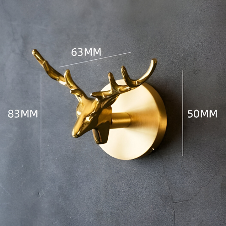 Stilfull klädkrok i guld med djurmotiv. Perfekt för hallen, sovrummet och organisering.