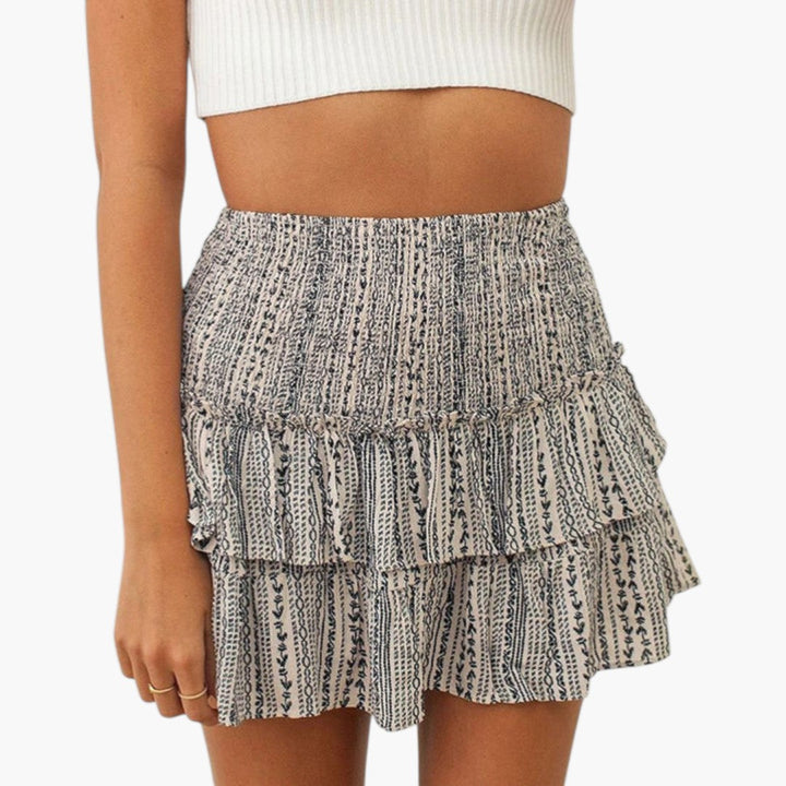 Högmidjad minikjol med volanger, kvinnors trendiga design, passar både sommar och fest.