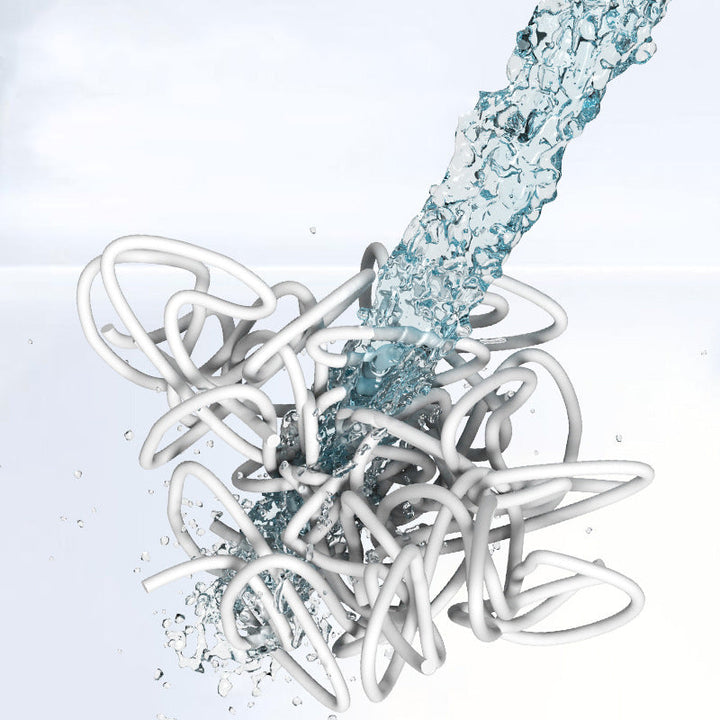 "Halkfri badrumsmatta i PVC, grå/beige, med dräneringshål för säkerhet och komfort i badrummet."