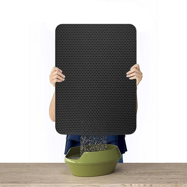 Halkfri kattsandmatta i svart TPE-gummi, fångar upp sand och skyddar golv. Idealisk för rena husdjurshushåll.