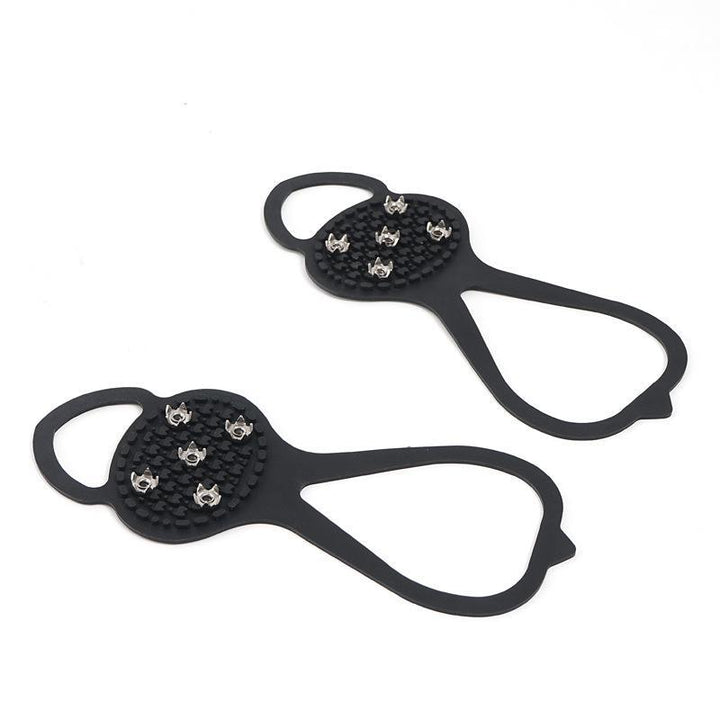 "Halkfria silikon skoskydd, unisex, svart, robusta stålpinnar för isigt underlag, designade för säker vintergång."