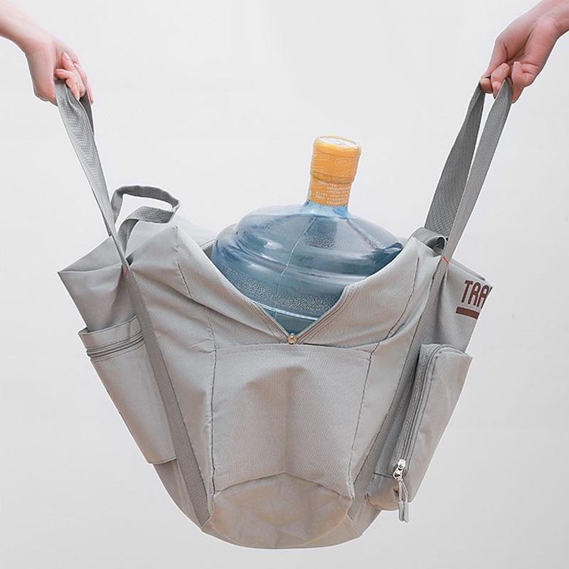 "Hållbar hopfällbar resväska i grå nylon med extra kapacitet; lätt, unisex design för resor och vardagspendling."