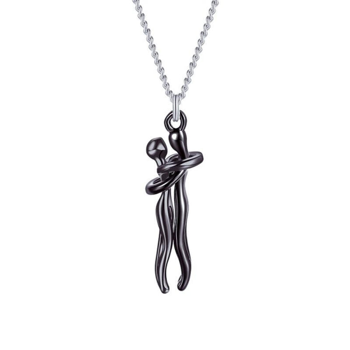 Förpackat halsband med kramande figurer, redo som present - tillverkat i rostfritt stål.
