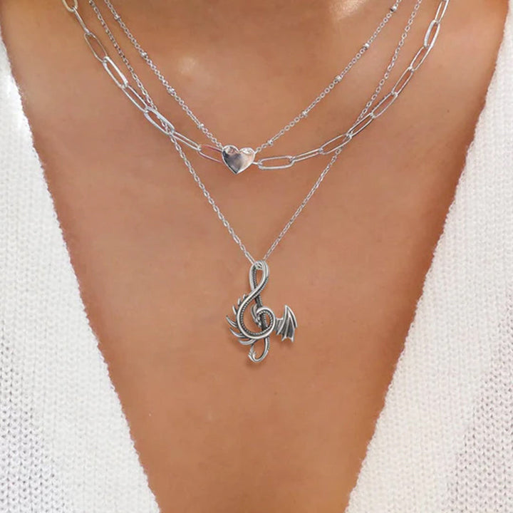 "Halsband med drakdesign i legering, detaljerad och elegant för både vardag och fest, symboliserar styrka och visdom."