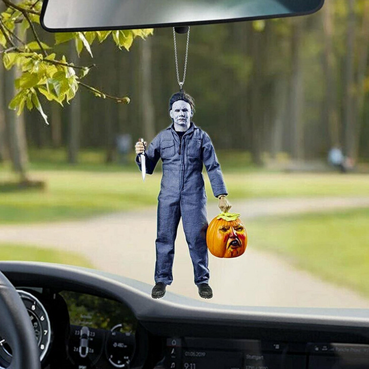 Handgjord halloweenprydnad i harts, detaljerad och handmålad med skrämmande design för bilens interiör eller nyckelring.
