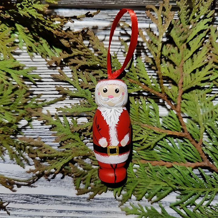 Handgjord tomteleksak i färgglatt trä, perfekt som julprydnad med överraskningseffekt för glädje och skratt.