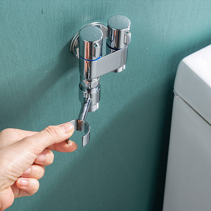 "Handhållen bidéspruta för badrum med dubbelkontroll, elegant design i mässing, justerbart vattenflöde och flexibel slang."