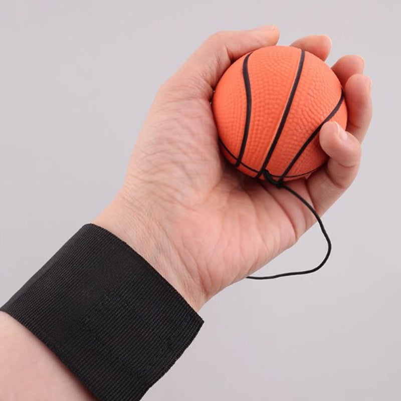 "Handledsband med studsande boll, träningsredskap i gummi och nylon, designad för lek och reflexövningar, orange basketboll."