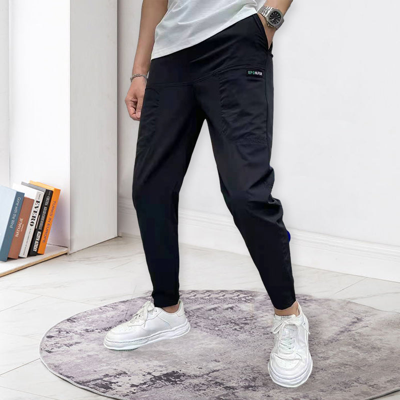 "Herr Cargo-byxor i högstretch, framifrån, gråa med flera fickor, perfekt för urban stil, komfort och vinterbruk."