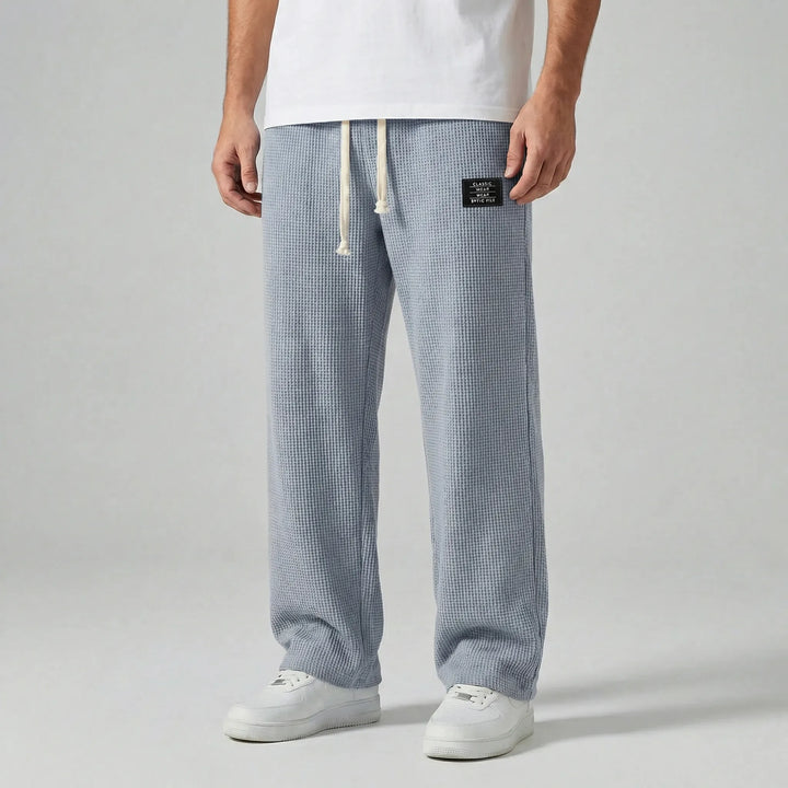 Bekväma herrbyxor Toby: Mörkgrå sweatpants med dragsko, perfekta för vardagsbruk och ledig stil.