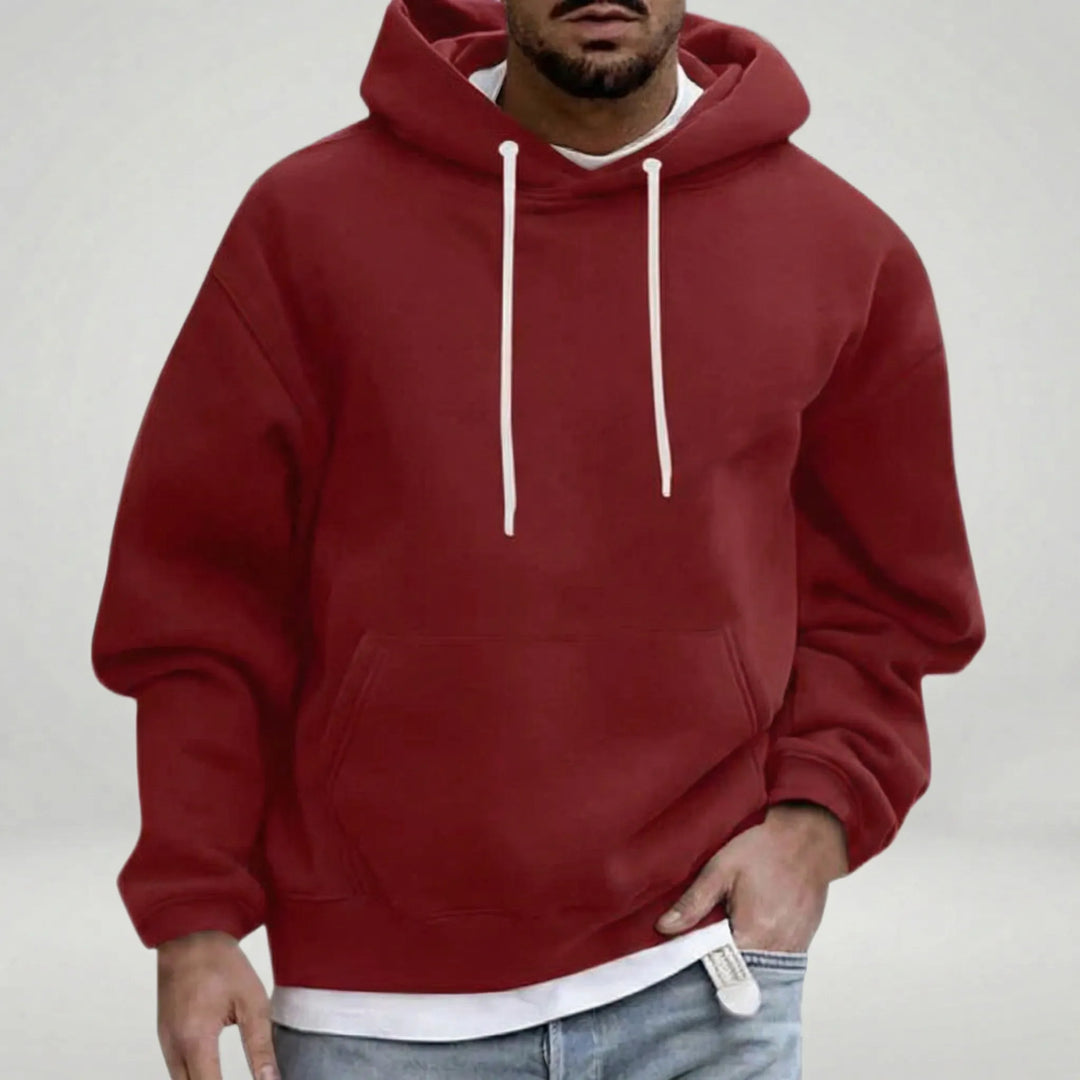 Stilfull herr huvtröja med ledig passform. Mjuk och bekväm pullover, idealisk för avslappnade dagar.