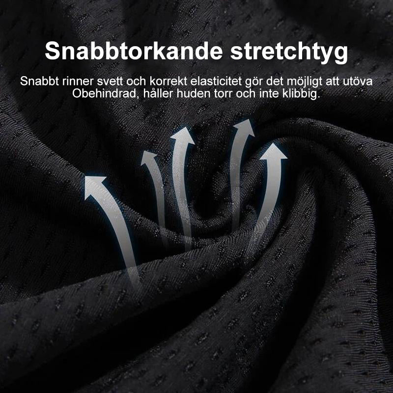 "Herr snabbtorkande fitnessbyxor i svart med elastisk midja och fickor, perfekt för träning och rörelsefrihet."