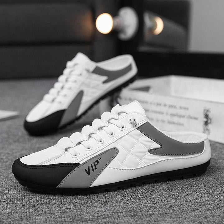 "Herr sneakers i syntetskinn med öppen häl, rund tå och slip-on design, perfekta för vardaglig användning."