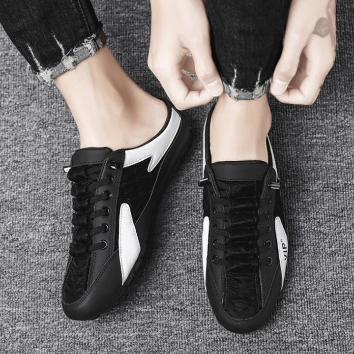 "Herr sneakers i syntetskinn med öppen häl, rund tå och slip-on design, perfekta för vardaglig användning."