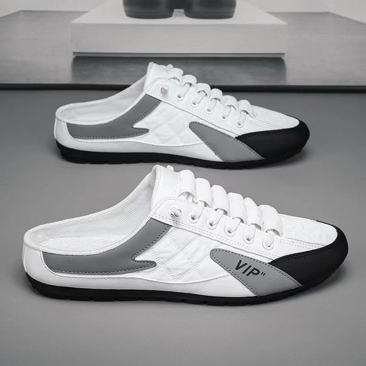 "Herr sneakers i syntetskinn med öppen häl, rund tå och slip-on design, perfekta för vardaglig användning."