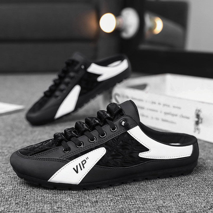 "Herr sneakers i syntetskinn med öppen häl, rund tå och slip-on design, perfekta för vardaglig användning."
