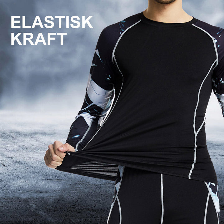 "Herr sportkläder tights och långärmad tröja i grått, stretchigt tyg, designad för träning och rörelsefrihet."